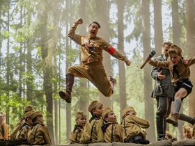 Taika Waititi and Roman Griffin Davis in the film JOJO RABBIT. Photo by Kimberley French. © 2019 Twentieth Century Fox Film Corporation All Rights Reserved